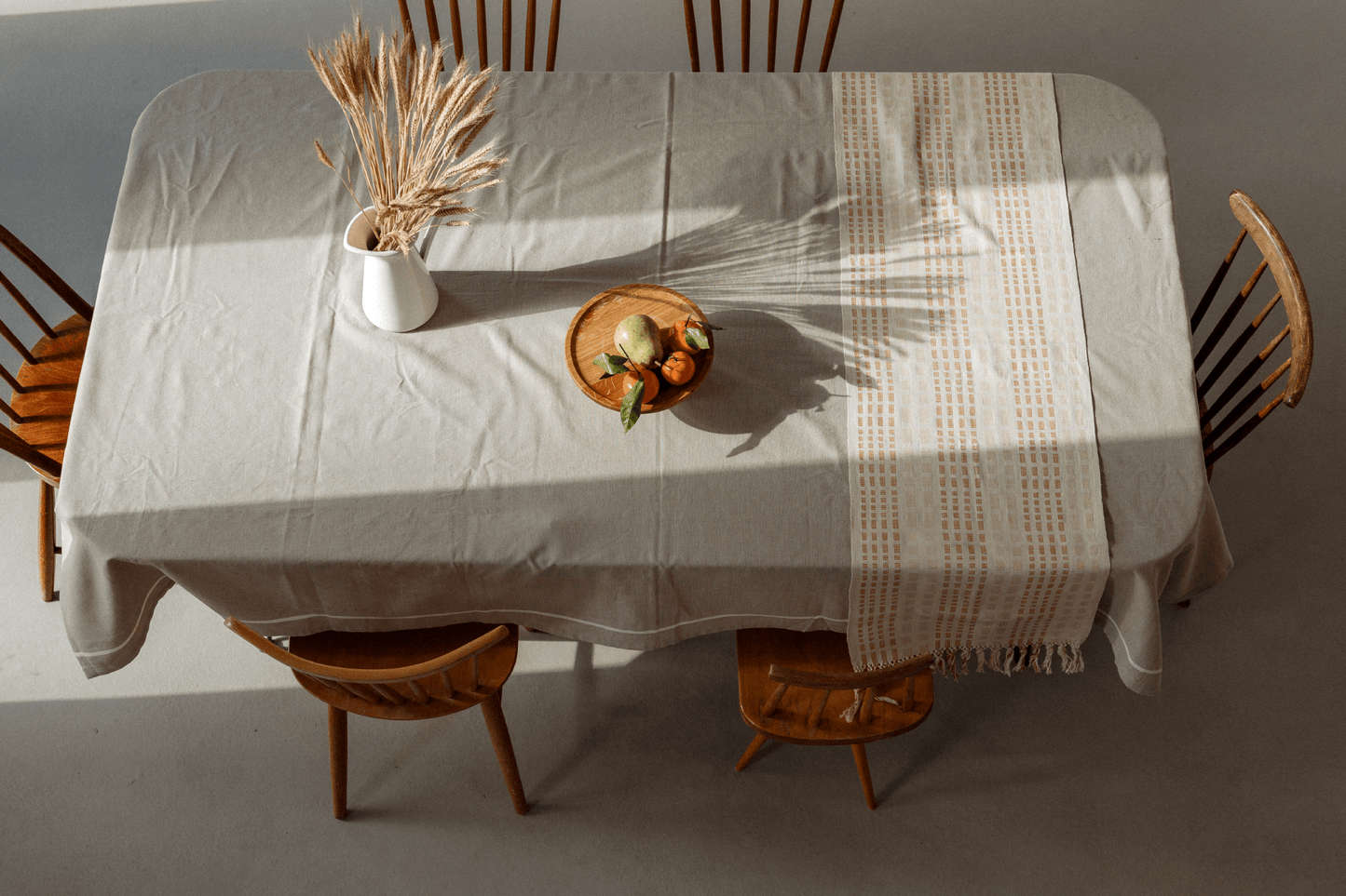 Cotton table runner on cotton table cloth